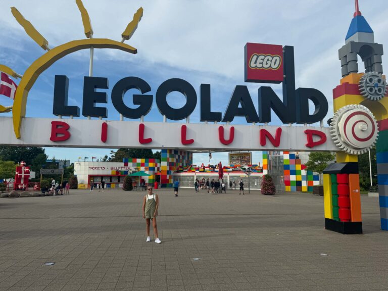 Girl standing at the entrance to Legoland Billund in Denmark